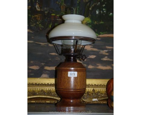 A 20th c. working Oil Lamp complete with globe and shade, 18'' tall overall