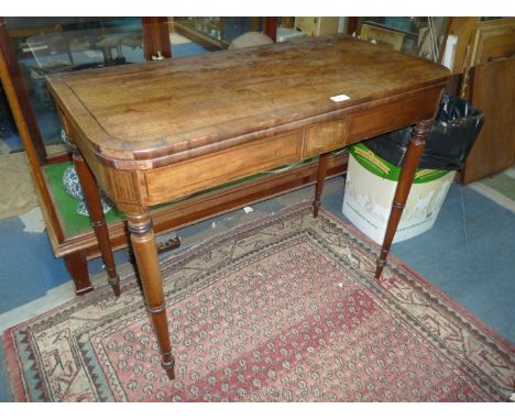 A Victorian flap-over Card Table, the cross-banded top with contrasting stringing rotating to reveal a compartment beneath an