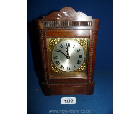 An Oak cased mantel/bracket Clock by H.A.C., Wurttemberg, Germany with key present, 8 3/4" tall by 5 1/2" wide.