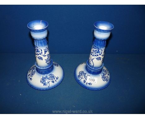 A pair of Carlton Ware blue and white rose pattern Candlesticks, 8 3/4'' tall.