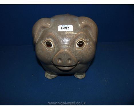 A large, grey, happy ceramic pig, 8" tall.