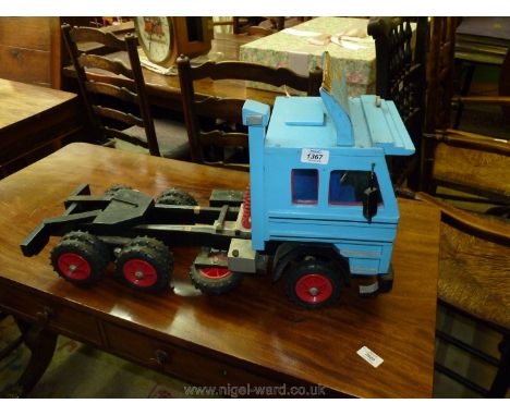 An apparently scratch-made, mainly painted wood realistic model of a Scania V8 triple-axle ten-wheeled articulated lorry trac