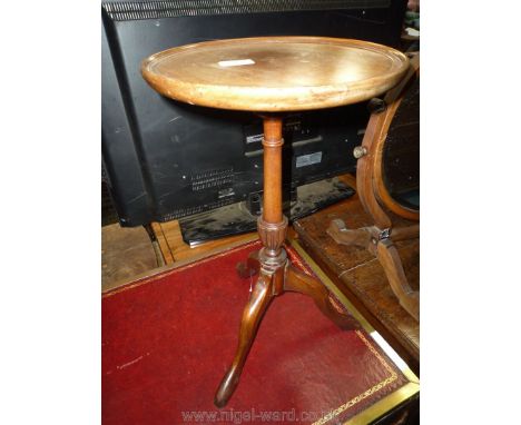 A contemporary Mahogany Wine Table having a turned and lobed pillar on three splay feet. 11 3/4'' diameter x 20 3/4'' high.