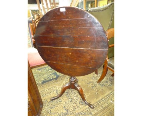 A dark Oak Snap-top occasional table standing on a turned pillar with elegant splay feet. 28 1/4'' diameter x 26 1/4'' high.