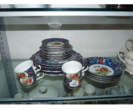 A Gump's part tea-set to include tea plates, four cups and saucers, four bowls, two scalloped edge plates and two smaller pla