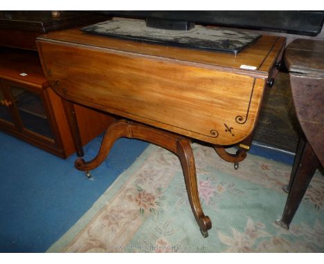 A 19th c. Mahogany drop-leaf Pembroke table standing on a central turned pillar, the platform base with four scroll-terminati