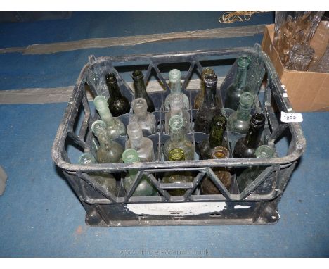 A crate of 20 vintage bottles.