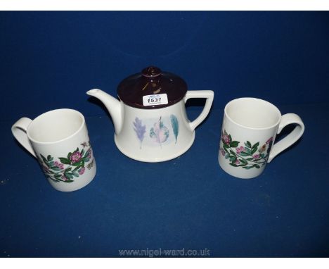 A Portmeirion teapot in 'Dusk' pattern and two Portmeirion mugs.