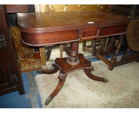 An elegant William IV period flap-over Tea Table standing on a tapering turned pillar upon a platform base having four splay 