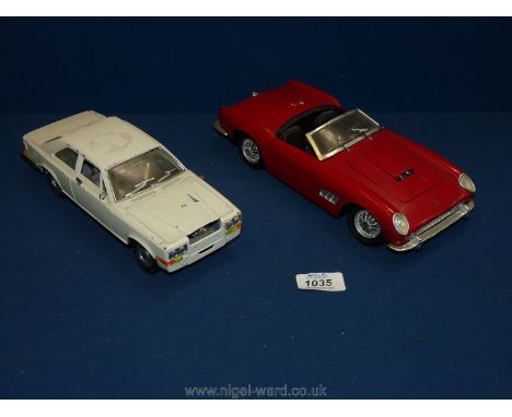 Two vintage model cars including a "Burago" Rolls Royce Camargue and a "Polistil" red Ferrari. 