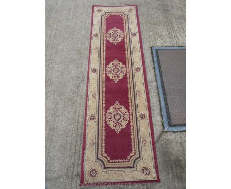 A long Runner with tan border and Burgundy panel to centre with three circular patterns, by Monte Carlo, 95'' x 27''.