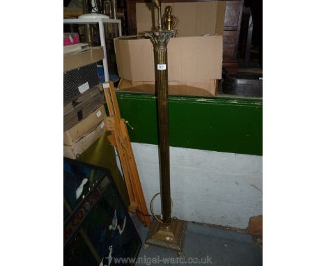 A brass standard lamp.