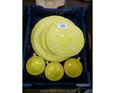 A twelve piece Portuguese Secla (Majolica style) yellow cabbage leaf Dinnerware set for three to include three cups, saucers,