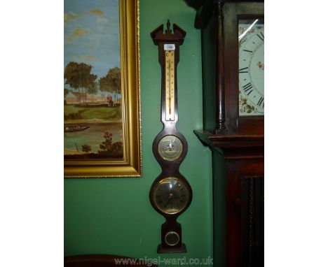 A wooden barometer, clock and thermometer combined with brass coloured faces, 33" long.