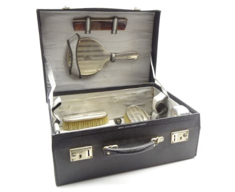 Ladies leather dressing case by Boswell, Edinburgh with watered silk interior and containing a silver backed 6 piece dressing