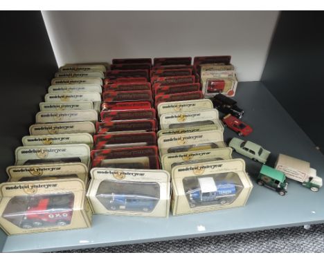 A shelf of Lledo and Matchbox Models of Yesteryear and similar diecasts, most in display boxes, approx 45 in total, along wit