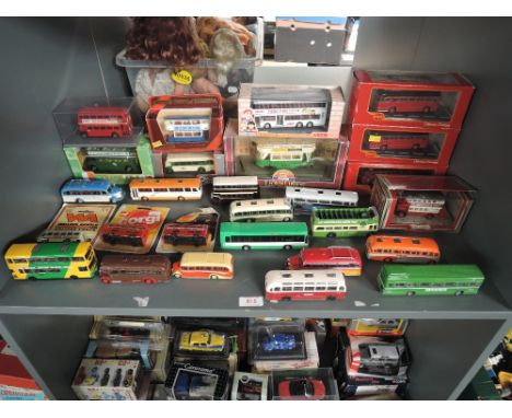 A shelf of Corgi Original Omnibus, EFE and similar diecast Buses along with similar Trams, boxed and loose, approx 25