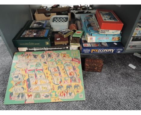 A shelf of vintage games including Operation, Buccaneer, Poleconomy, Skirrid, Abbott Toys Zoo Zag, Playing Cards, Modern Ches