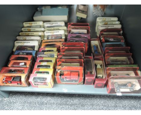 A shelf of modern Matchbox Models of Yesteryear diecasts, various vintage, approx 46 in total all boxed