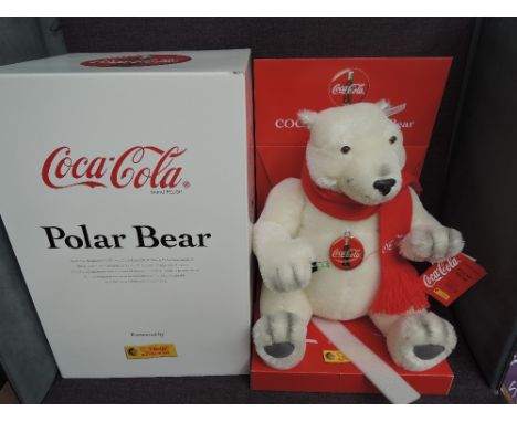 A Limited Edition Steiff Bear, Polar Bear Coca Cola 670336 5675/10000, white tag, display stand, certificate and box