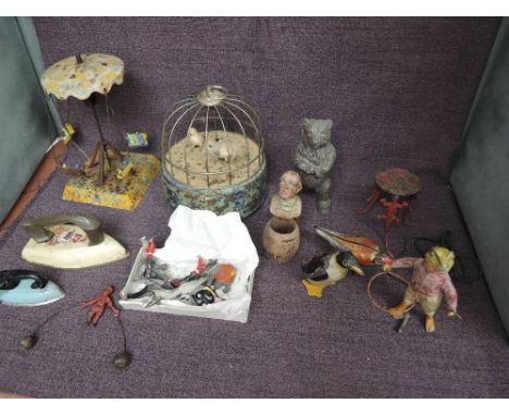 A selection of Lead, Tin plate and Hollow Cast Toys and figures including Musical Bird Cage, Fairground Swing Ride, hollow ca