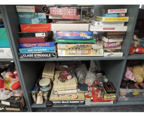 Two shelves of vintage Games and Puzzles including Tank Battle, Class Struggle, Spy Ring, Survival, Abbott Toys Zoo Zag, vint