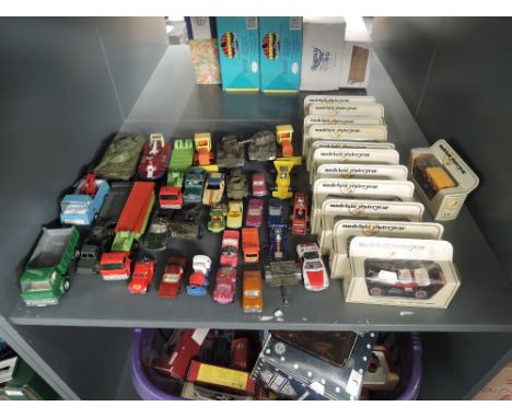 A shelf of playworn and boxed diecasts including Matchbox Lesney, Dinky, Tonka, Matchbox, Models of Yesteryear etc, approx 40