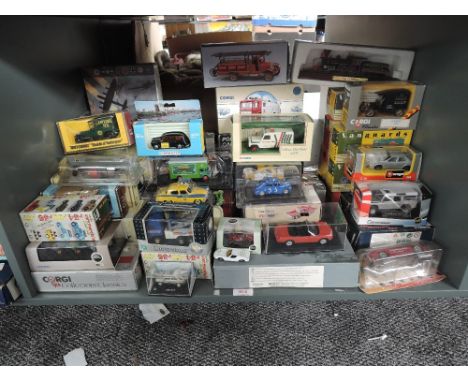 A shelf of modern diecasts including Vanguards, Saico, Matchbox, Oxford etc, all boxed approx 50