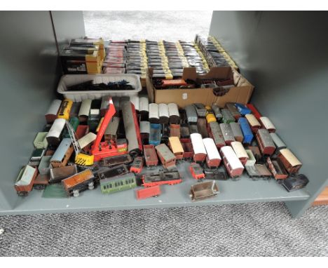 A shelf of 00 gauge Rolling Stock, mainly Hornby, various condition and repair, 70+ items