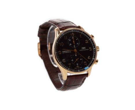 GENTLEMAN'S IWC EIGHTEEN CARAT ROSE GOLD PORTUGIESER CHRONOGRAPH AUTOMATIC WRIST WATCH, the round dial with applied gold Arab