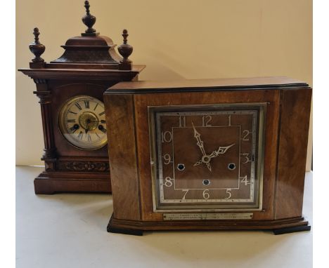 A walnut cased Westminster chiming clock together with a walnut cased mantle clock with carved columns.