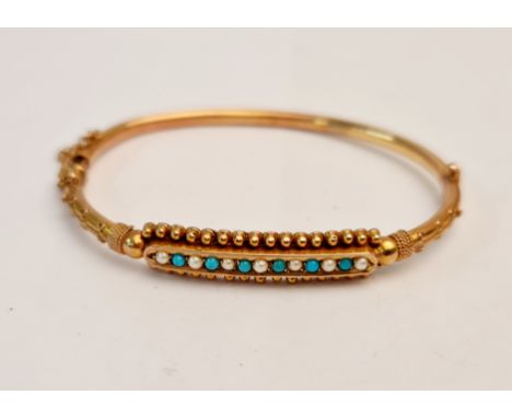 A stamped 9ct turquoise and pearl stone bangle with safety chain. approx 7.7 grams.