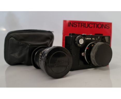 A Leica CL Leitz Wetzlar camera body with two lenses Elmar-c 1:4/90, and Summicron-c 1:2/40. (Damage to glass)