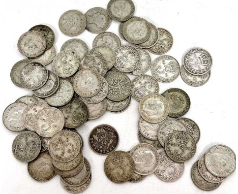 Seventy 3d silver pence coins, various dates, 99 gms, housed in a metal compact