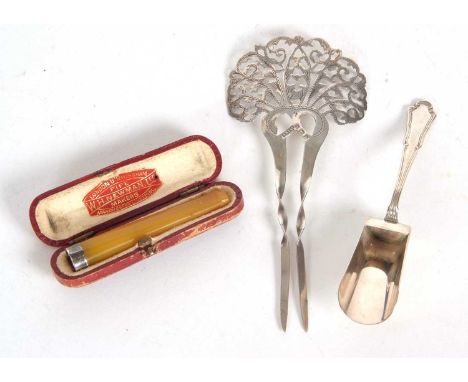 Mixed Lot: An Edwardian silver hair comb, the crown intricately pierced and engraved, with two twisted prongs, hallmarked Bir