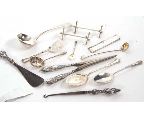 Mixed Lot:  George III silver sauce ladle, a pair of Victorian silver knife rests, a Victorian long handled condiment spoon, 