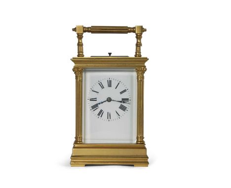 Late 19th/early 20th Century French gilt metal and glass panelled gorge carriage clock with half corinthian columns to the co