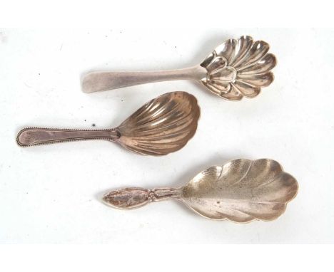 A George III silver caddy spoon having an oval shaped shell bowl and beaded edge detail to the handle, engraved with initials