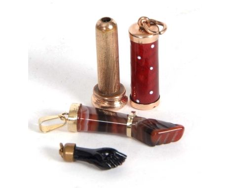 Mixed Lot: An antique enamel extending telescope pencil charm together with two figure Good Luck charms (3)