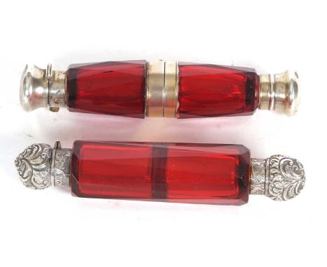 A Victorian ruby glass binocular double ended scent bottle, the faceted glass folds at the mid point, one end hinged with a p