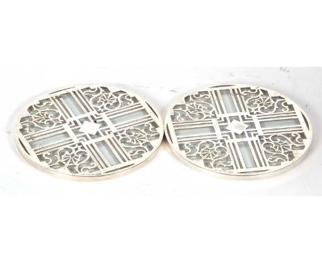 Two matching vintage pierced silver and glass teapot stands, hallmarked for Birmingham 1939/40, makers mark for Mappin &amp; 