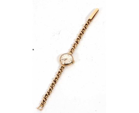 A 9ct gold Zenith lady's wristwatch, the watch is stamped 375 on the side of the case and the bracelet clasp, it has a manual