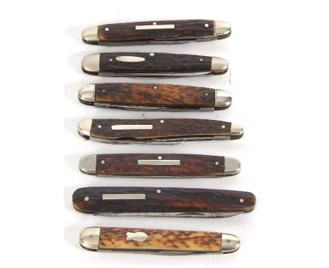 Group of seven stag horn handled pocket knives, an Army and Navy two bladed pocket knife, 9.5cm long, a three bladed example 