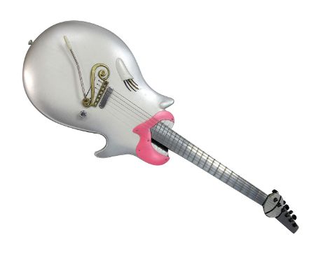 Silver Novelty Electric Guitar, it is made by Eastwood and has Eastwood Electric woman print on the back of the head.