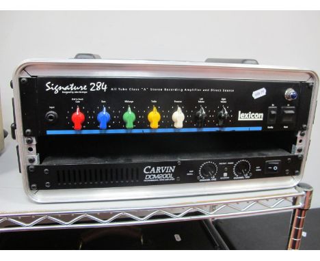 Two Rack Mountable Amplifiers, a Lexicon Signature 284 Stereo recording amplifier, together with a Carvin DCM200L 200 watt po