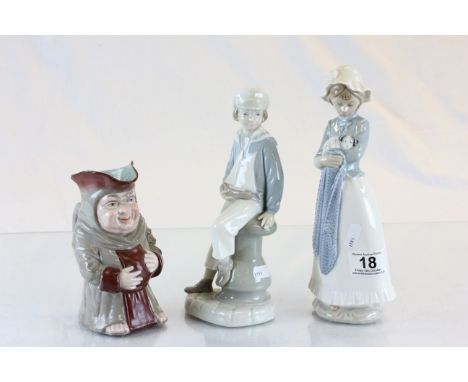 Three ceramic figures to include; Lladro boy with toy boat numbered 4, Nao girl with puppy numbered B-175 & a Toby jug in the