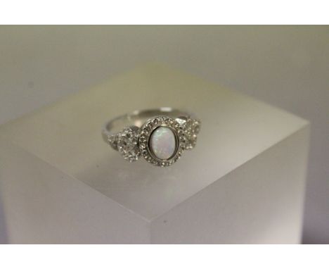 Silver CZ ring set with opal central panel