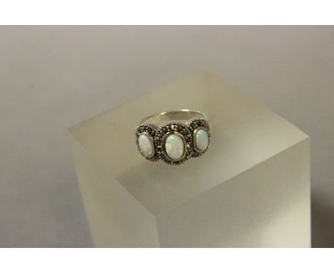 Silver and opal three stone ring