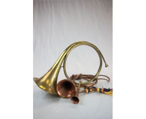 Two french hunting horns and a fox hunting horn, along with a coaching horn