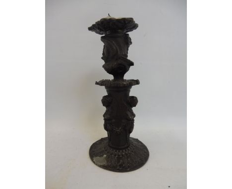 An unusual and well detailed bronze candlestick. 